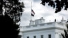 The U.S. flag is lowered to half-staff at the White House following the death of Britain's Queen Elizabeth, in Washington, Sept. 8, 2022.