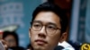 FILE - Pro-democracy activist Nathan Law is interviewed by journalists outside the Final Court of Appeal after being granted bail in Hong Kong, China Oct. 24, 2017. 