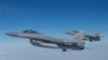 FILE - F-16 fighter jets fly during a NATO media event at an airbase in Malbork, Poland, March 21, 2023.