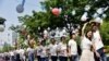 FILE - Couples attend a mass wedding ceremony in Rugao, Jiangsu province, China May 20, 2020. 