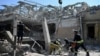 Members of Ukraine's emergency services conduct a search and rescue operation at the site where a hotel was hit by a missile in Kramatorsk, in Ukraine's Donetsk region, Aug. 25, 2024.