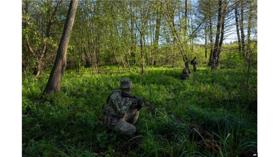 A Ukrainian Border Guard soldier participates in a military exercise in central Ukraine, May 2, 2023.
