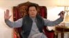 Pakistan's former prime minister Imran Khan talks with reporters regarding the current political situation and the ongoing cases against him at his residence, in Lahore, Aug. 3, 2023. 