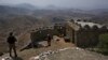 FILE - Pakistan army troops observe the area from hilltop post on the Pakistan-Afghanistan border, Aug. 3, 2021. Pakistan says increased terrorist attacks from the neighboring country are straining an already difficult bilateral relationship.