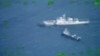 In this image released by the Armed Forces of the Philippines, a Philippines supply boat, top left, sails near a Chinese coast guard ship, top right, and a Chinese militia vessel in the disputed South China Sea, Oct. 22, 2023.