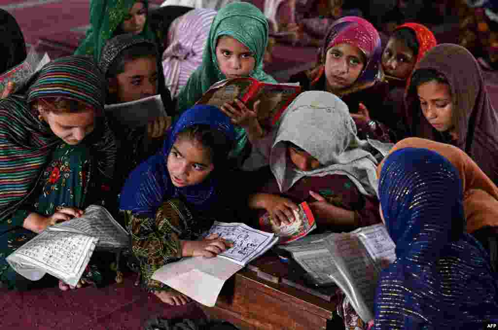 Children recite holy book Quran at a mosque in Lahore, Pakistan, June 18, 2023. 