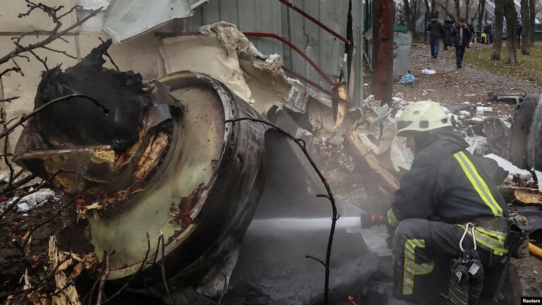 FILE - A firefighter extinguishes remains of an unidentified missile, which Ukrainian authorities claimed to have been made in North Korea, at a site of a Russian strike in Kharkiv, Ukraine, on Jan. 2, 2024.