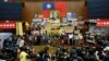 FILE - In this April 7, 2014 photo, students occupy the Parliament floor to protest against a trade pact with China in Taipei, Taiwan. Many activists from the "Sunflower Movement" are now running for elected office to help bring about change. 