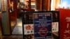 This picture shows a sign reading "Suspend the sale of all fish products imported from Japan" in an area of Japanese restaurants in Beijing, Aug. 27, 2023.