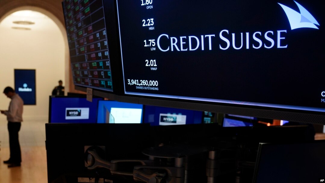 A sign displays the name of Credit Suisse on the floor at the New York Stock Exchange in New York, March 15, 2023.