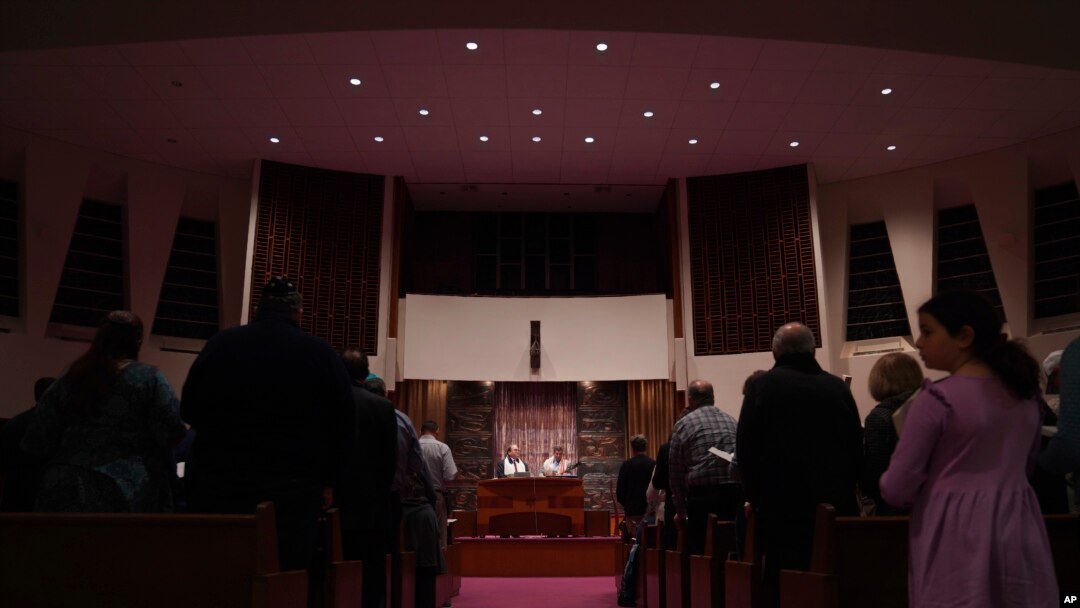 Rabbi Daniel Fellman, left, and Cantor David Reinwald, right, lead Shabbat service, Oct. 13, 2023, at Temple Sinai in Pittsburgh, Pennsylvania.