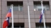 An empty flag pole where Nauru's flag used to fly is pictured next to flags of other countries at the Diplomatic Quarter which houses embassies in Taipei, Taiwan, Jan. 15, 2024. 
