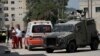 Members of the Israeli forces inside an armored vehicle check an ambulance during a military operation in the West Bank city of Jenin, Aug. 28, 2024.