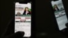 A man checks a social app to monitor the official site of the Pakistan Tehreek-e-Insaf party (PTI) party, as a telethon to launch the PTI manifesto and raise campaign funds is launched, amid widespread Internet disruptions, in Islamabad, Jan. 7, 2024.