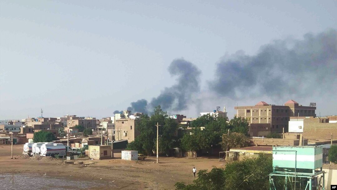 FILE - Smoke rises over Khartoum, June 23, 2023, as clashes continued between warring factions in and around Sudan's capital.