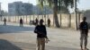 FILE - Security personnel guard a blocked road after an attack by Pakistani Taliban militants in Bannu district in Pakistan's Khyber Pakhtunkhwa province, Dec. 20, 2022. A suicide bomber killed at least nine Pakistani soldiers in the district on Aug. 31, 2023.