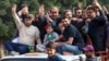 FILE — Sher Afzal Marwat, top center, senior vice president and election candidate of former Prime Minister Imran Khan's Pakistan Tehreek-e-Insaf party, leads a campaign rally in Hyderabad on Jan. 15, 2024, ahead of the country's general election. 