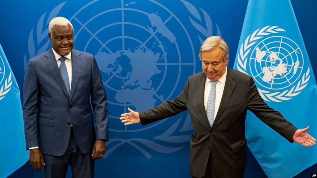 FILE - Chairperson of the African Union Commission Moussa Faki Mahamat, left, meets with United Nations Secretary-General Antonio Guterres at U.N. headquarters, Sept. 18, 2022.