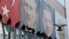 Posters of Mustafa Kemal Ataturk (L) founder of modern Turkey, and current President Recep Tayyip Erdogan are displayed at the Spice Bazaar plaza, during the re-opening ceremony following its restoration in Istanbul, May 4, 2018. 