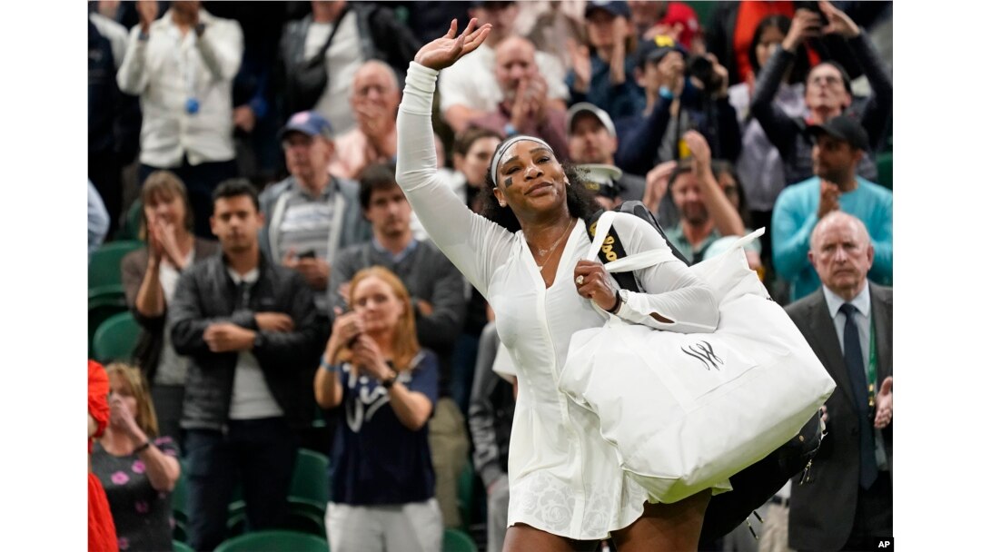 FILE - Serena Williams waves as she leaves the court after losing to France's Harmony Tan in a first round women's singles match on day two of the Wimbledon tennis championships in London, June 28, 2022.