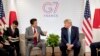 U.S President Donald Trump, right, and Japanese Prime Minister Shinzo Abe attend a bilateral meeting at the G-7 summit in Biarritz, France, Aug. 25, 2019. 