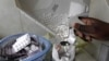 FILE - Anti-retroviral (ARV) drugs are dispensed by a pharmacist at a hospital in Kenya's capital Nairobi, Sept. 10, 2015. 