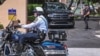 Secret Service and local law enforcement officers are seen in front of the home of former President Donald Trump at Mar-a-Lago in Palm Beach, Florida, on Aug. 9, 2022. 