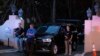 Armed Secret Service agents stand outside an entrance to former President Donald Trump's Mar-a-Lago estate, Aug. 8, 2022, in Palm Beach, Florida. 