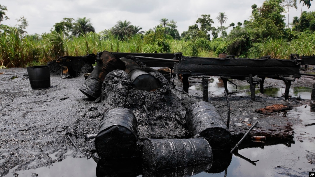FILE - An abandoned illegal oil refinery is seen at the creeks of Bayelsa, Nigeria, May 18, 2013.