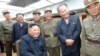 FILE - North Korean leader Kim Jong Un guides the test firing of a new weapon, in this undated photo released on August 11, 2019, by North Korean Central News Agency.