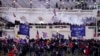 FILE - Rioters are seen at the U.S. Capitol on Jan. 6, 2021, in Washington. 