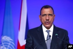 FILE - Niger's President Mohamed Bazoum speaks at the U.N. Climate Change Conference COP26 in Glasgow, Scotland, Nov. 1, 2021.