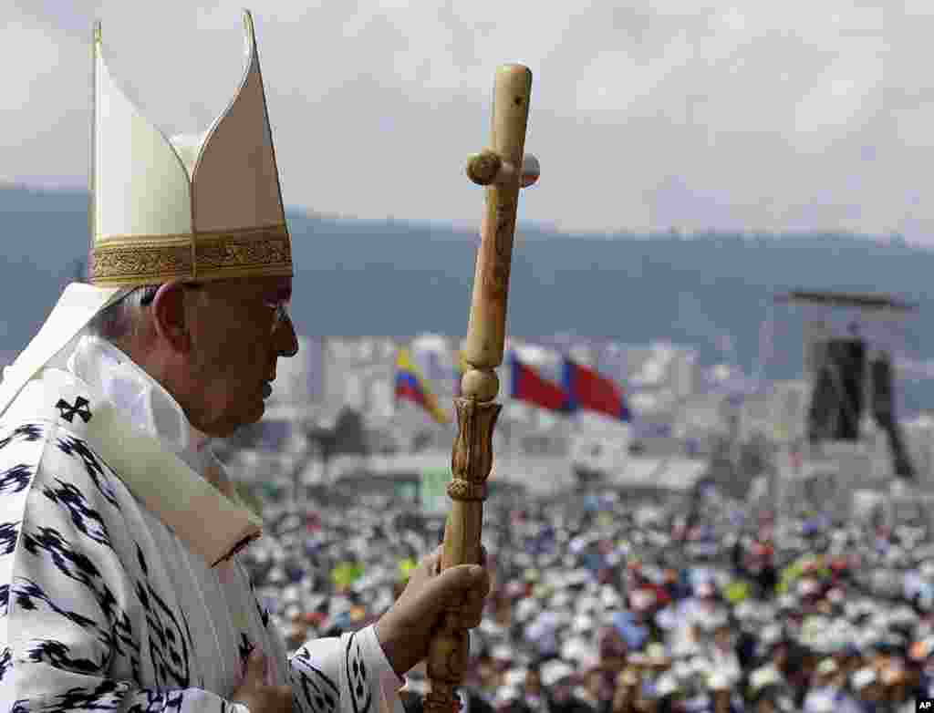 Pope Francis walks with his pastoral staff to celebrate Mass at Bicentennial Park in Quito, Ecuador, July 7, 2015.