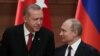 FILE - Presidents Tayyip Erdogan of Turkey and Vladimir Putin of Russia hold a joint news conference after their meeting in Ankara, Turkey, April 4, 2018.