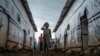 FILE - Internally displaced children run in an alley of a camp in the town of Azezo, in Ethiopia's Amhara region, July 12, 2021. The camp hosts Ethiopians as well as Eritrean refugees uprooted by the war in Tigray.