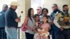 Guests leave Sacred Heart Catholic Church following the joint funeral service for Irma Garcia and husband Joe Garcia, June 1, 2022, in Uvalde, Texas. Irma Garcia was killed in last week's elementary school shooting; Joe Garcia died two days later. 