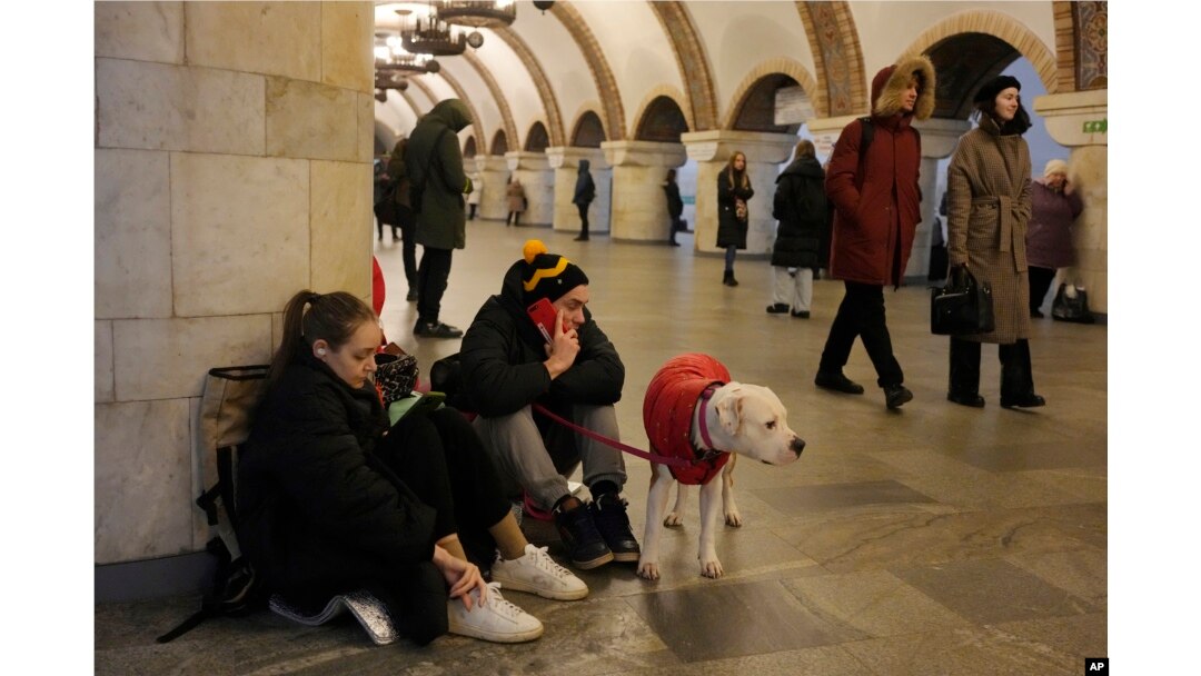 People rest in the subway station being used as a bomb shelter during a rocket attack in Kyiv, Ukraine, Thursday, Dec. 29, 2022. (AP Photo/Efrem Lukatsky)