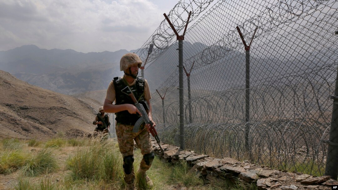 FILE - In this Aug. 3, 2021, file photo, Pakistan Army troops patrol along the border of Pakistan and Afghanistan. Pakistan said on Dec. 29, 2022, that at least three of its soldiers were killed in clashes with “terrorists” near the border.