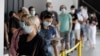 People wait in a line at a COVID-19 testing station on the northern beaches in Sydney, Australia, Dec. 21, 2020. 