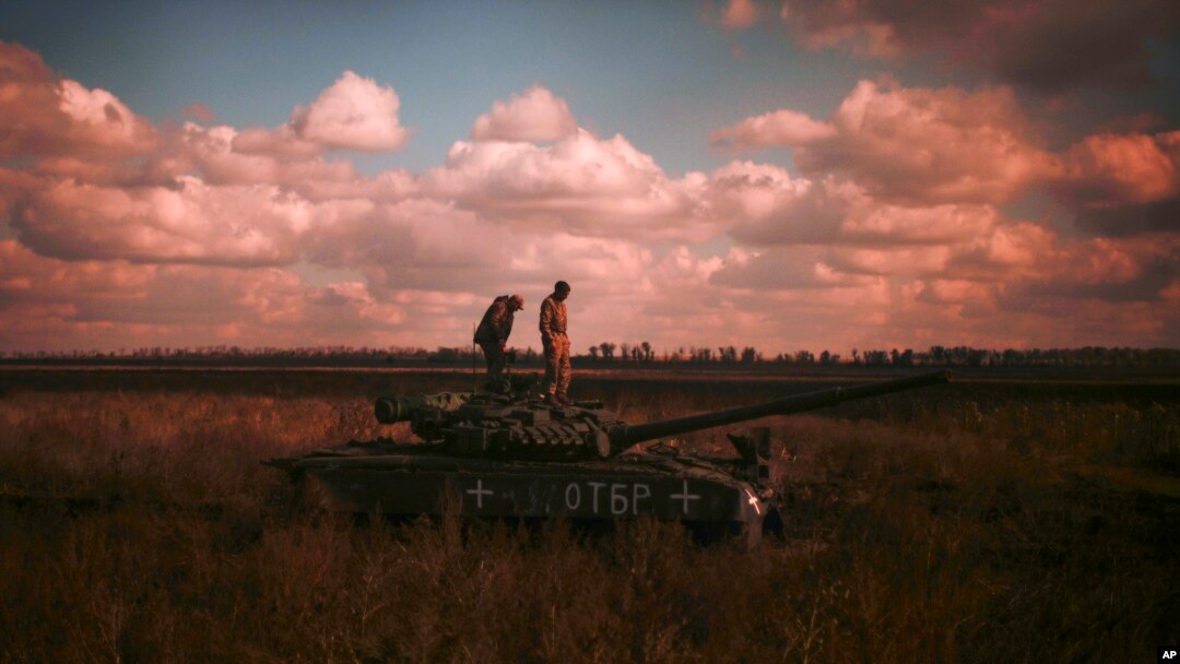 Ukrainian servicemen stand on top a Ukrainian tank near the recently retaken village of Borova, east Ukraine, Oct. 7, 2022.