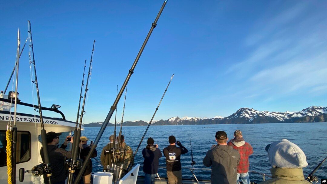 Participants, members of the armed services, and crews of the annual ASYMCA Alaska Combat Fishing Tournament are seen on May 25, 2022, in Seward, Alaska. The tournament, which began in 2007 and now involves more than 300 soldiers, includes a day of deep-w