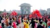 Students and youth of Pyongyang participate in a dancing party to commemorate the 10th anniversary of Kim Jong Un's election as the top party and state leader at the plaza of Arch of Triumph in Pyongyang, North Korea, April 11, 2022. 