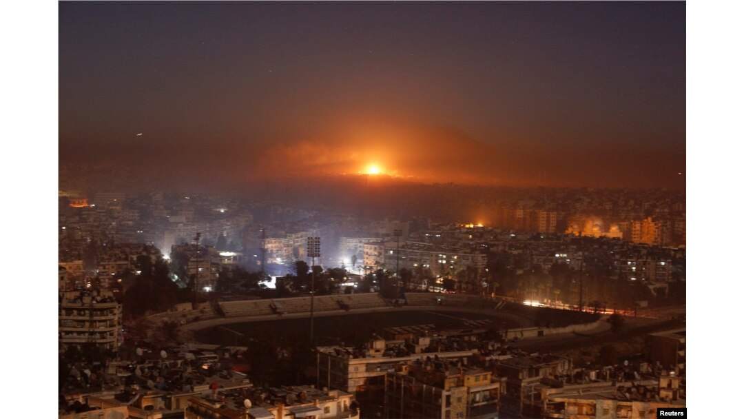 Smoke and flames rise after air strikes on rebel-controlled besieged area of Aleppo, as seen from a government-held side, in Syria December 11, 2016.
