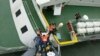 South Korea Coast Guard work to rescue survivors of the sinking ferry, Sewol, April 16, 2014. (South Korea Coast Guard)