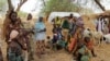 FILE - Violence in northern Nigeria is a long-standing problem. These Nigerian refugees, who fled into Niger following attacks on their village, stand in the yard of their Nigerien host, in Diffa, on June 21, 2016.