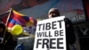FILE - A protester displays a placard during a demonstration against China in Times Square in New York, Feb. 13, 2015, demanding for the freedom of Tibet. New research has renewed global discussion about China's decadeslong persecution of Tibetans in the autonomous region.