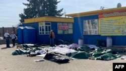 Casualties are laid out next to a platform after the bombing of a railway station in the eastern city of Kramatorsk, Ukraine, in the Donbass region, on April 8, 2022.
