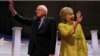 Democratic U.S. presidential candidates Senator Bernie Sanders and former Secretary of State Hillary Clinton arrive on stage ahead of the start of the PBS NewsHour Democratic presidential candidates debate in Milwaukee, Wisconsin, Feb. 11, 2016. 