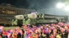 North Korean Leader Mum as Military Parade Rolls Out Largest ICBM Display  