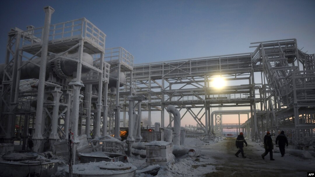 FILE - People walk through Novatek's Arctic LNG 2 project, located in Russia's Gydan Peninsula on the Kara Sea shore line in the Arctic circle, on Nov. 30, 2021. The U.S. targeted the Arctic LNG 2 project, among others, with new sanctions against Moscow on Nov. 2, 2023.